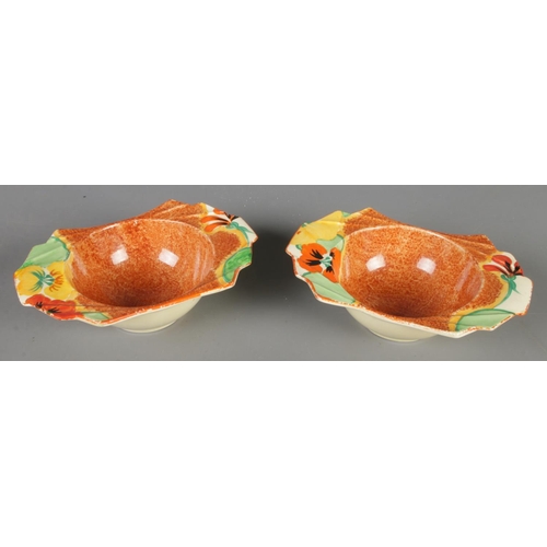 131 - A pair of Clarice Cliff Newport Pottery grapefruit dishes in the Nasturtium design. (5cm x 17cm x 12... 