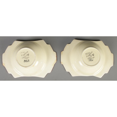 131 - A pair of Clarice Cliff Newport Pottery grapefruit dishes in the Nasturtium design. (5cm x 17cm x 12... 