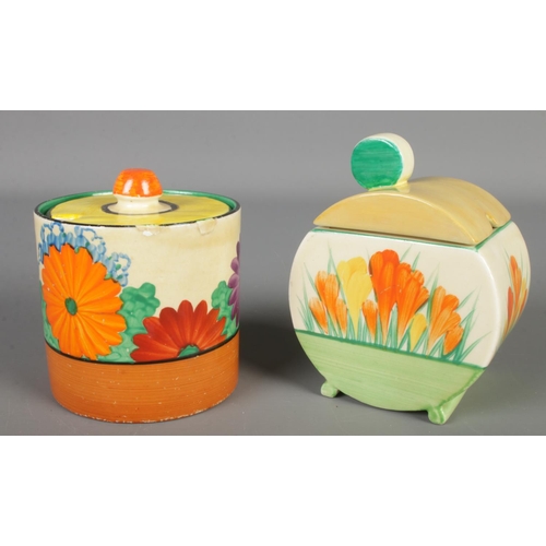 132 - Two Clarice Cliff preserve pots. Includes Gay Day and Sun Gleam Crocus designs.