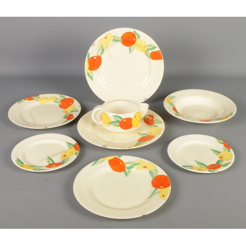 133 - Eight pieces of Clarice Cliff ceramics in the Delecia Citrus pattern. Includes plates, jug, etc.