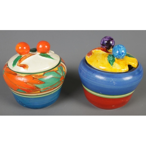 134 - Two Clarice Cliff preserve pots. Includes Fantasque and Bizarre range examples.