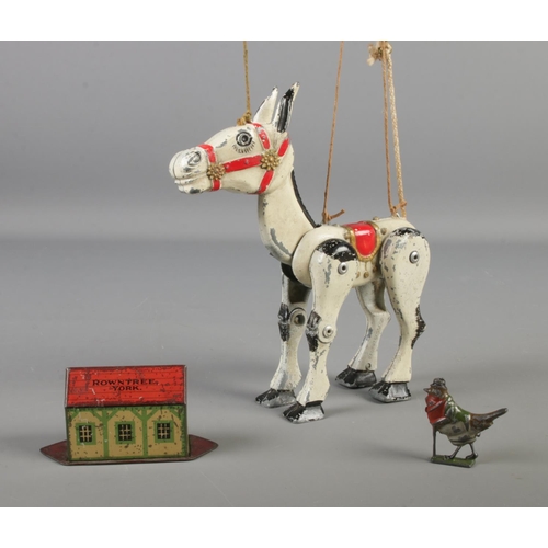 137 - A collection of metal collectibles including Muffin the Mule diecast puppet, Tinplate sweet tin Rown... 