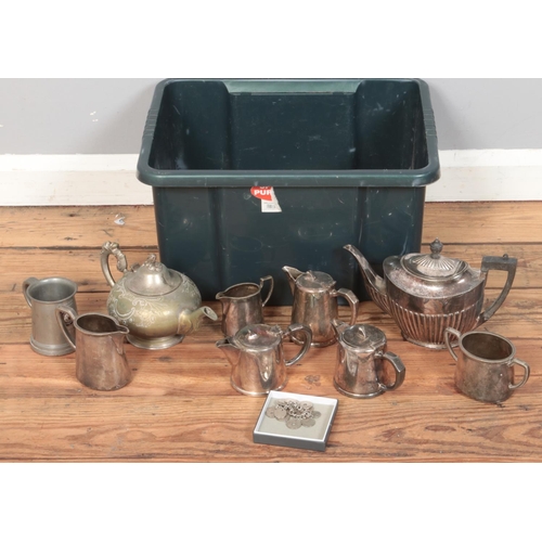 162 - A box of metalwares. Includes teapots, jugs, sugar bowls, etc.