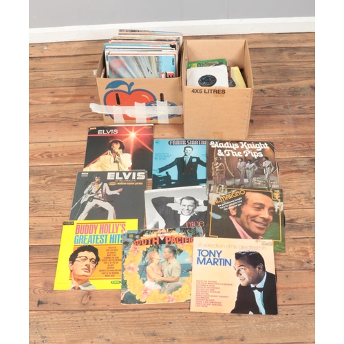 166 - Two boxes of assorted vinyl records and singles of mainly pop and easy listening to include Elvis, T... 