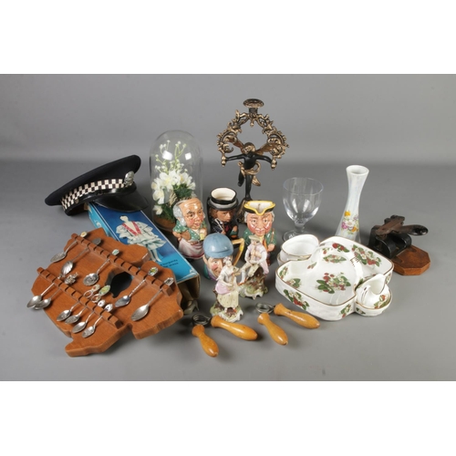 171 - A box of mixed collectables including spoons on rack, glass dome, candlestick, Staffordshire charact... 