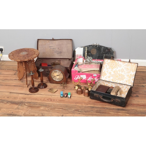 193 - One box and two small vintage suitcases of miscellaneous to include Indian brass bookends, assorted ... 