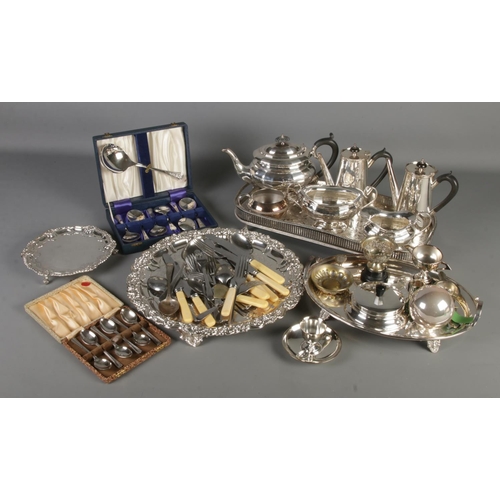 201 - A box containing a large quantity of silver plated items. Includes WMF egg cup stand, cased cutlery,... 