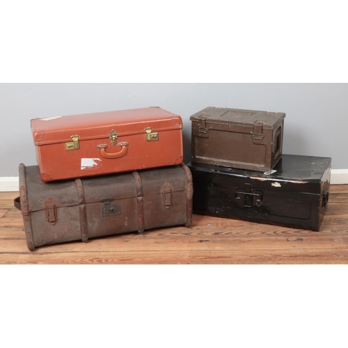 231 - A collection of vintage trunks and suitcases, to include wooden bound trunk and 1964 military ammuni... 