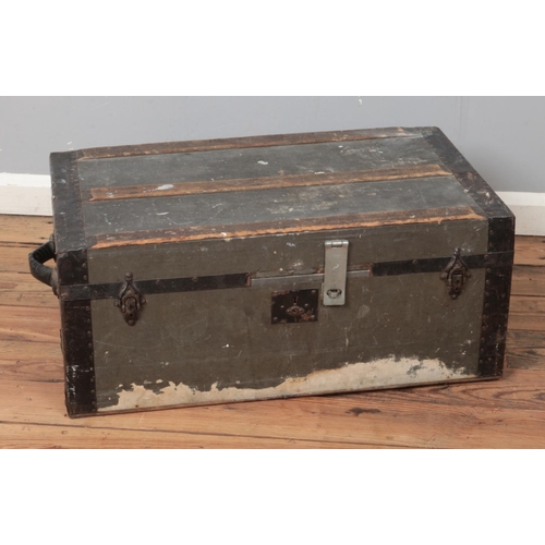 232 - A vintage wooden bound luggage trunk.