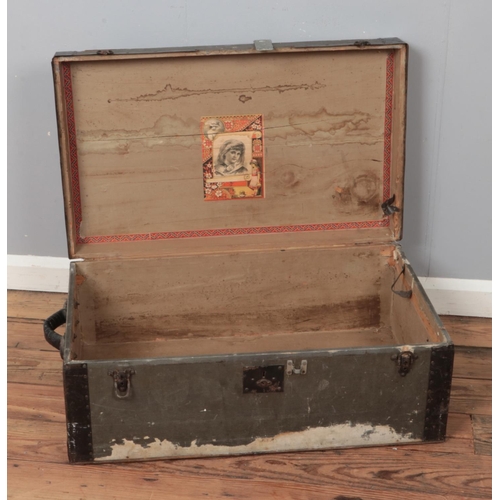 232 - A vintage wooden bound luggage trunk.