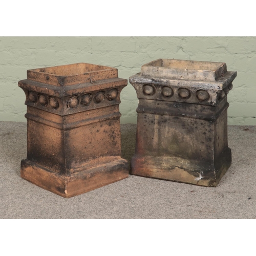 250 - Two terracotta chimney pots of rectangular form with beaded decoration. Height 47cm and 46cm, Width ... 