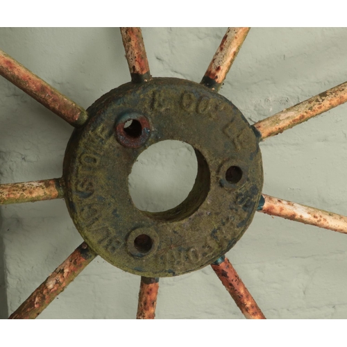 253 - A pair of antique painted iron cart wheels by Blackstone & Co Stamford. Diameter 122cm.