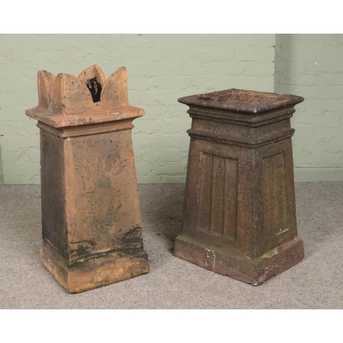 260 - Two terracotta chimney pots, one of tapering square form, the other with crown top. Tallest 83cm.