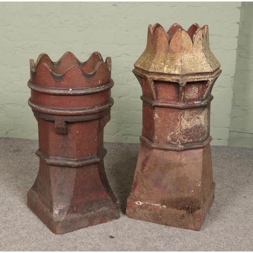 262 - Two treacle glazed stoneware chimney pots with crown tops. Tallest 89cm.