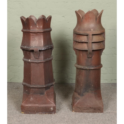 263 - Two large treacle glazed stoneware chimney pots with crown tops. Tallest 103cm.