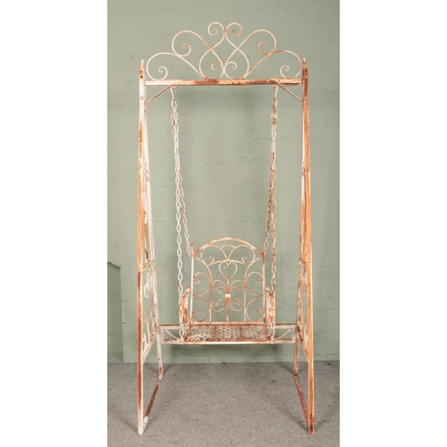 266 - A painted wrought iron single swing seat with scrolled decoration. Height: 237cm.