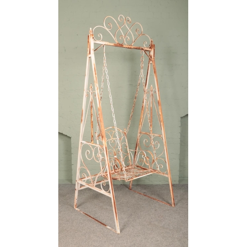 266 - A painted wrought iron single swing seat with scrolled decoration. Height: 237cm.