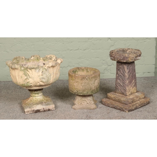 275 - A collection of concrete garden ornaments, to include tulip bowl planter and small bird bath.