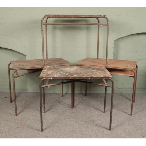 285 - Four vintage school desks, with tubular steel bases.