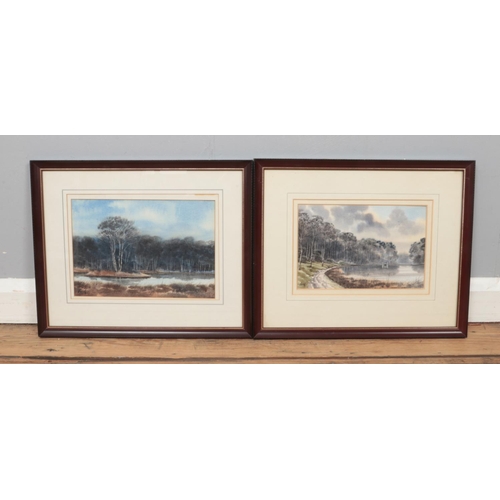 309 - George 'Griff' Griffiths (British 1939-2017), two framed watercolours of lake scenes, surrounded by ... 