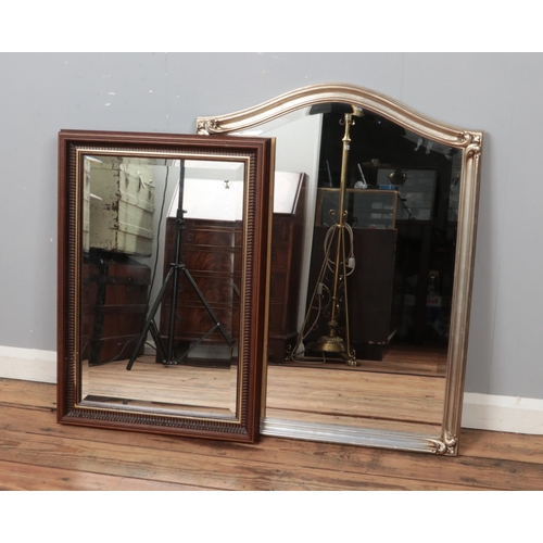 312 - Two framed bevel edge wall mirrors. One with mahogany frame, the other gilt.