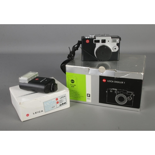 70 - A Leica Digilux 1 camera in original box with full contents including a Leica Flash Unit SF 20 also ... 