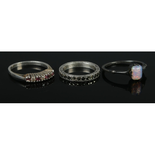 328 - Three silver rings, one set with opal stone. Sizes J½, O and P½. Total weight: 5.3g