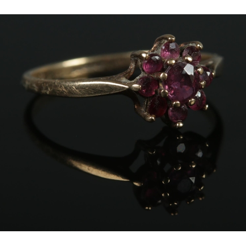 329 - A 9ct Gold and ruby cluster ring. Size M. Total weight: 1.3g