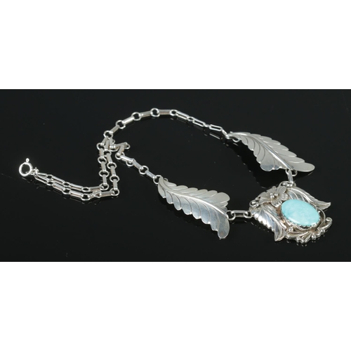 334 - A Sterling silver Navajo necklace, with central turquoise coloured stone. Stamped 'Sterling, N. Juan... 