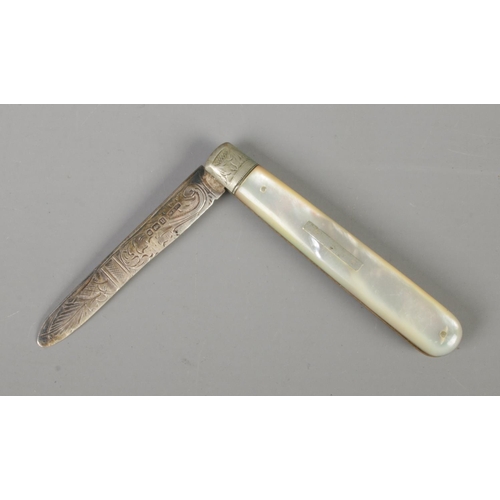 342 - A silver bladed fruit knife featuring mother of pearl handle and ornately carved blade. Assayed for ... 