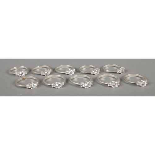 345 - Ten silver and three stone Cubic Zirconia rings, of various  sizes. Total weight: 20.5g