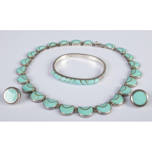 350 - A silver and turquoise three piece jewellery suite. Includes necklace, bangle and earrings. 120g gro... 