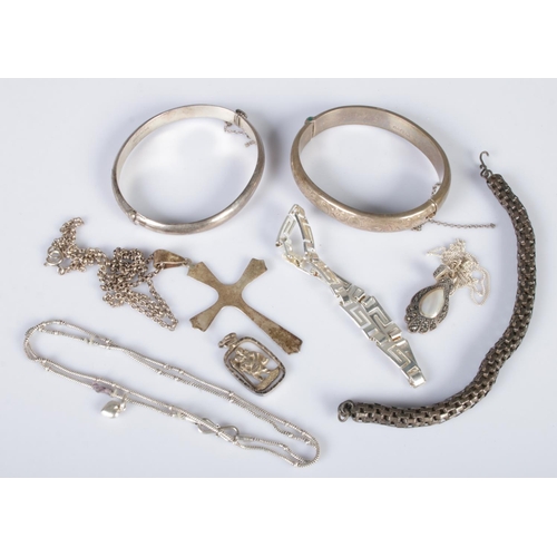 362 - A quantity of silver and white metal jewellery. Includes two silver bangles, necklaces, etc. 74g.