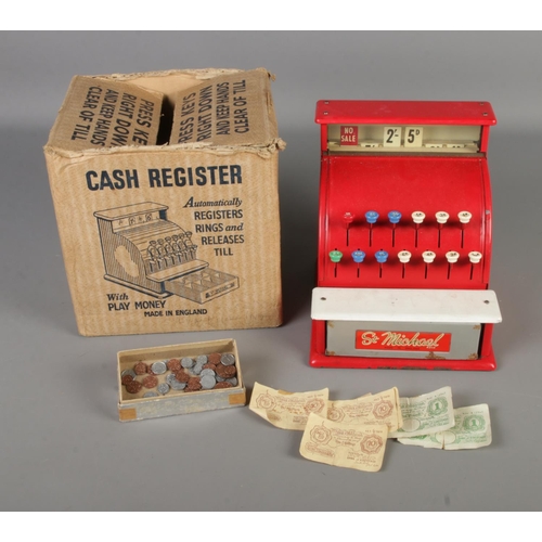 84 - A vintage children's tin plate St. Michaels cash register with original box. Also includes collectio... 