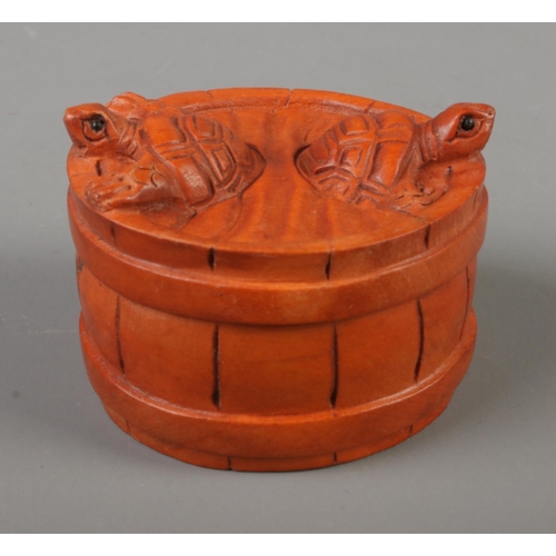 386 - A Japanese carved Netsuke in the form of two turtles in a barrel .