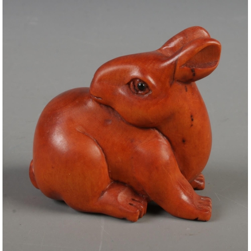 387 - A Japanese carved Netsuke in the form of a rabbit.