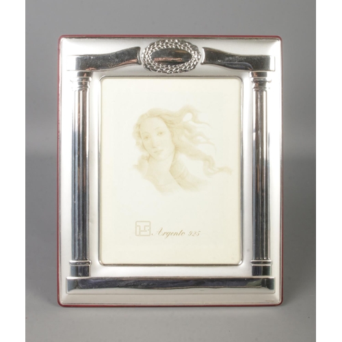 403 - A silver photo frame, with easel back and Greek style Corinthian pillar decoration. Stamped lower ri... 