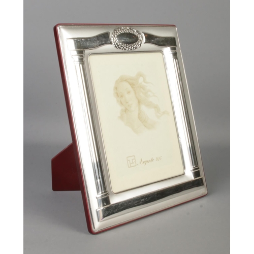 403 - A silver photo frame, with easel back and Greek style Corinthian pillar decoration. Stamped lower ri... 