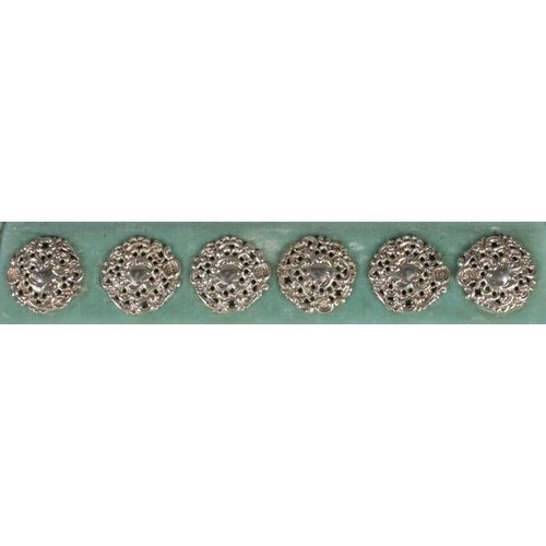 407 - A cased set of six Victorian ornate silver buttons. Assayed Birmingham 1900 by Levi & Salaman. 30g.