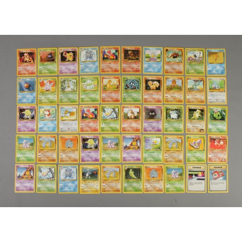 409 - A quantity of Pokemon cards. Includes base set, base set 2, jungle, fossil, Team Rocket, base set Ch... 