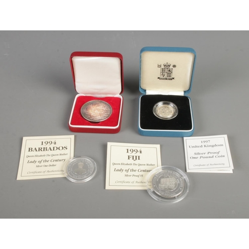 410 - Four silver coins to include Royal Mint Lady of the Century 1994 Barbados dollar and Fiji five dolla... 