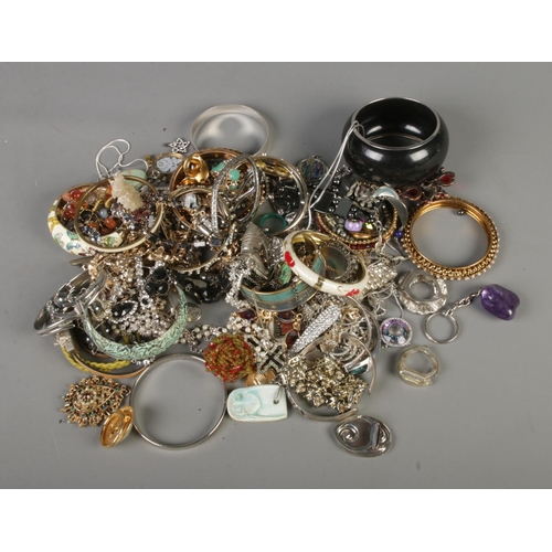 88 - A quantity of costume jewellery including bracelets, necklaces and brooches.