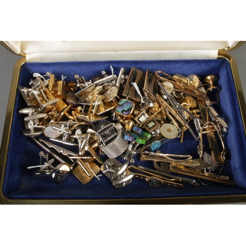 90 - A collection of 21 cufflinks along with tie pins and other items.