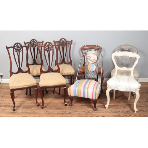 412 - Eight assorted chairs, to include a set of four Hepplewhite style dining chairs and unusual metal ex... 