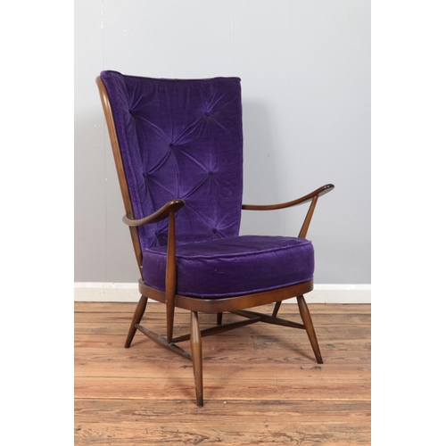 423 - Lucian Ercolani for Ercol; a dark beech/elm high spindle back armchair. Model Number 478. With purpl... 