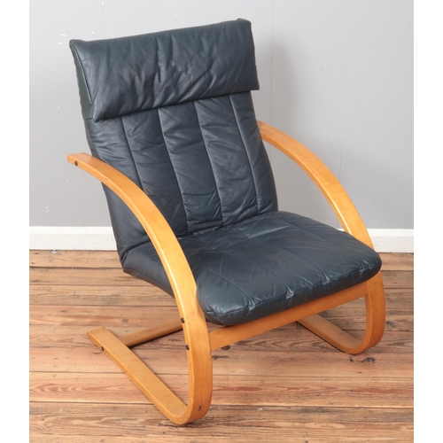 426 - A modern leatherette armchair.