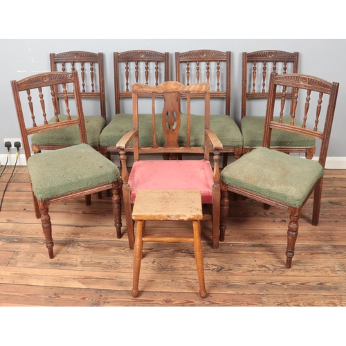 427 - Four upholstered dining chairs along with a similar example and a oak stool.