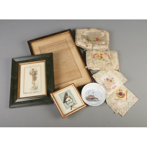 142 - A selection of embroided French souvenir handkerchiefs and pin cushions along with a framed French c... 