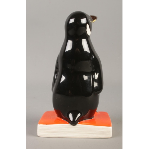 381 - A Royal Doulton for Penguin books figure modelled as penguin standing upon a book titled 'Best Wishe... 