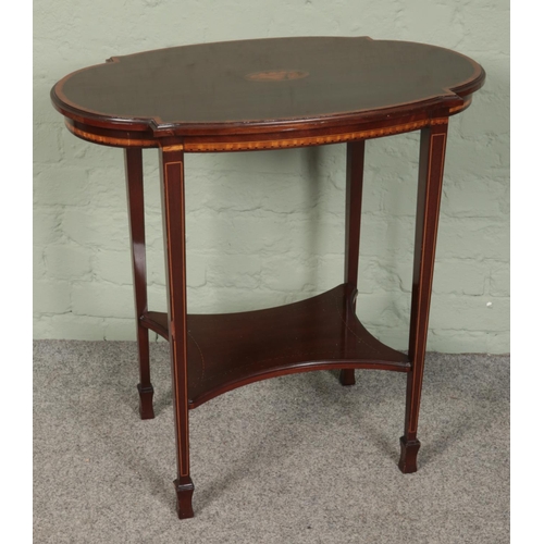 413 - A mahogany two tier window table with shell patera inlay.